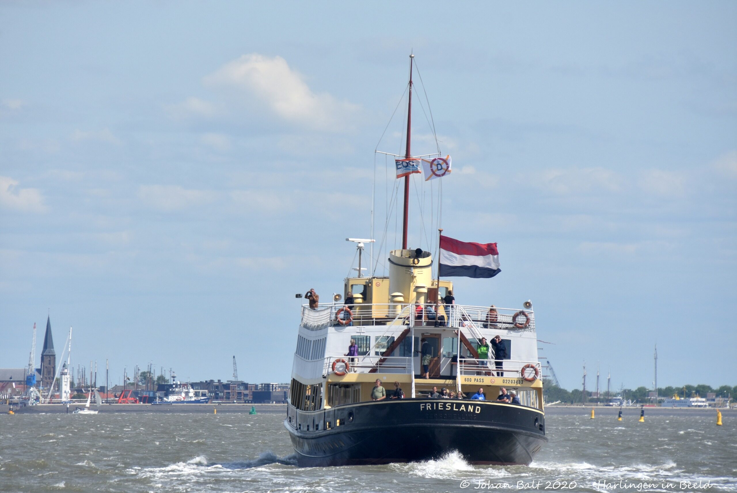 The ms Friesland with flags flying high